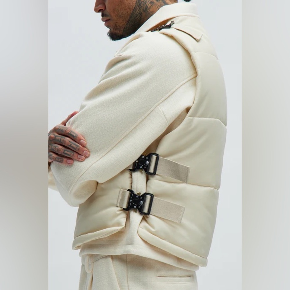 Roller Coaster Puffer Vest" in Off White from the brand Fashion Nova. - Picture 3 of 10